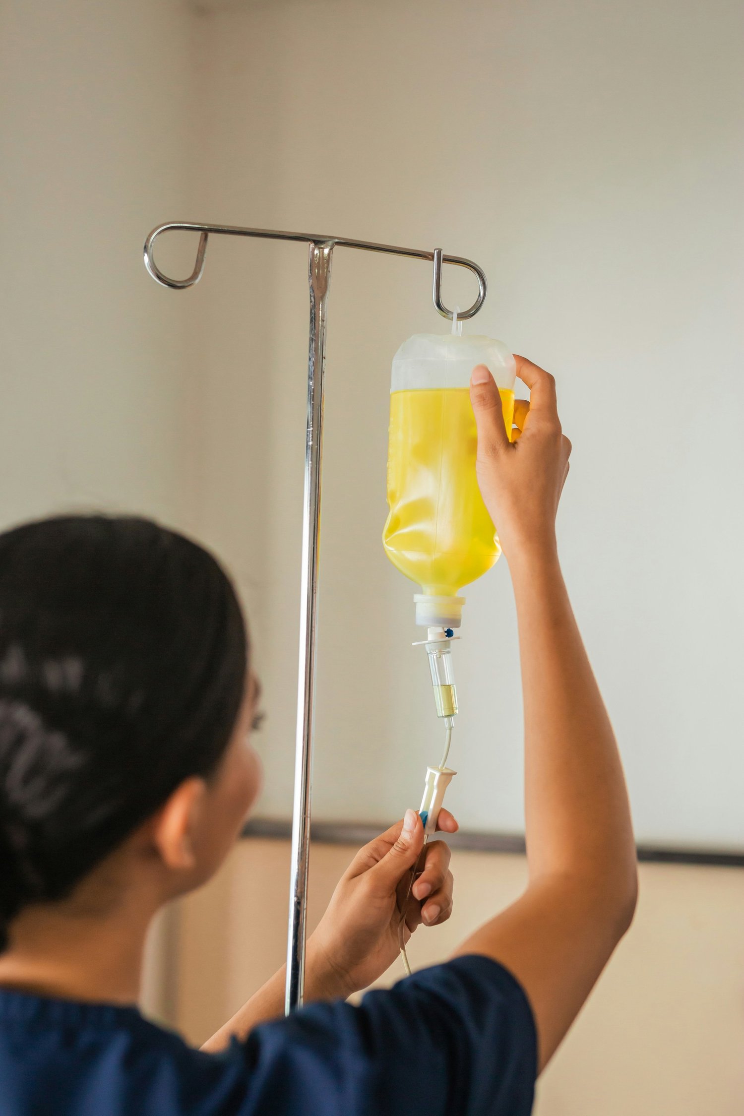 A nurse preparing a customized IV infusion